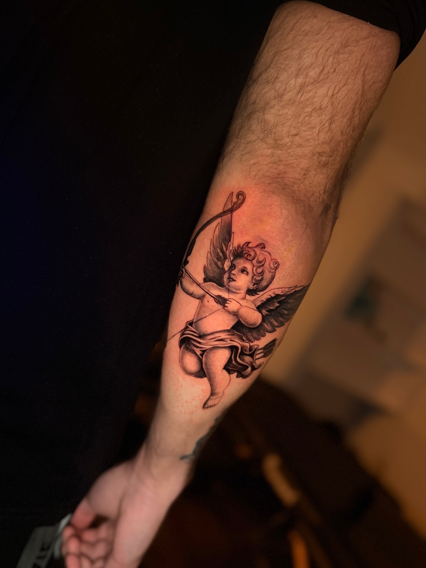 Detailed black and grey realism tattoo by Lukas Gois