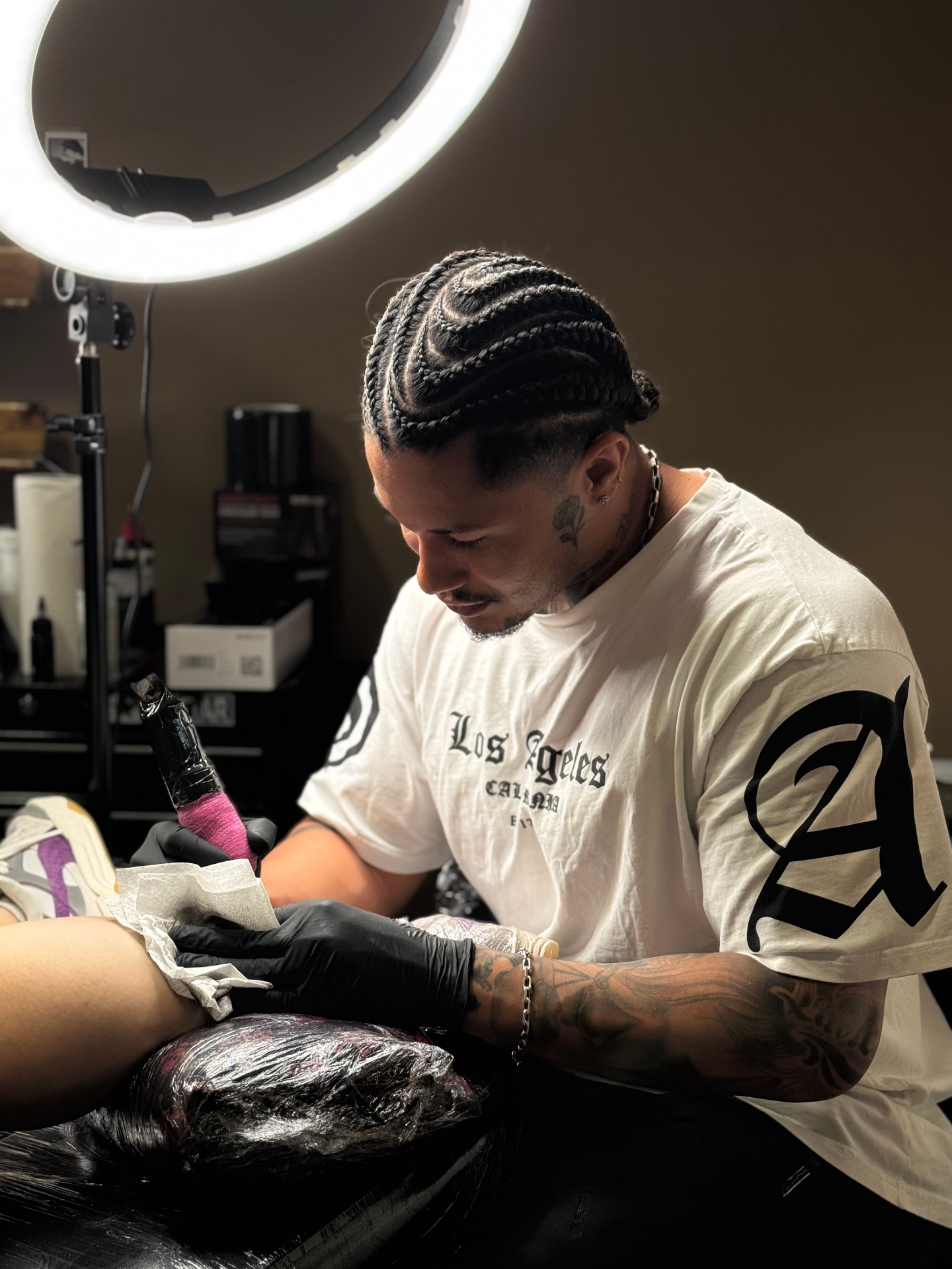 Lukas Gois tattooing a client in his Dublin studio